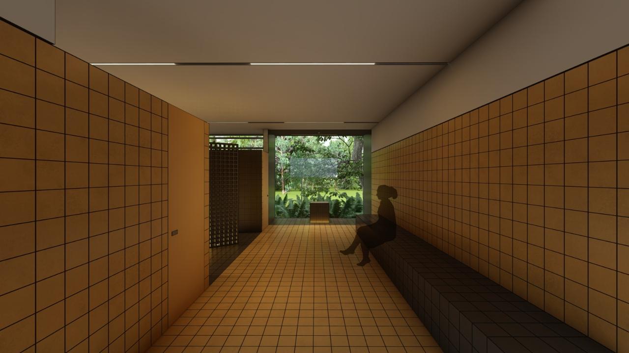 Ambiente revestido em cerâmica com banco e vista para o jardim